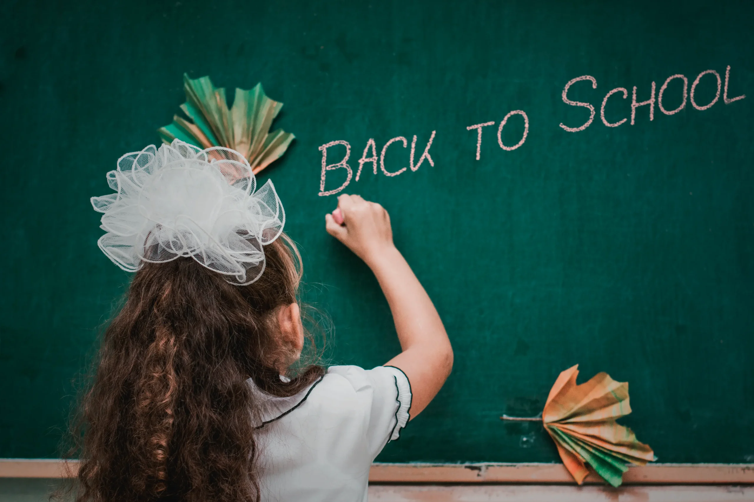 13 elementary school abajo. female child writes word on the board back to sch 2023 11 27 05 32 18 utc scaled