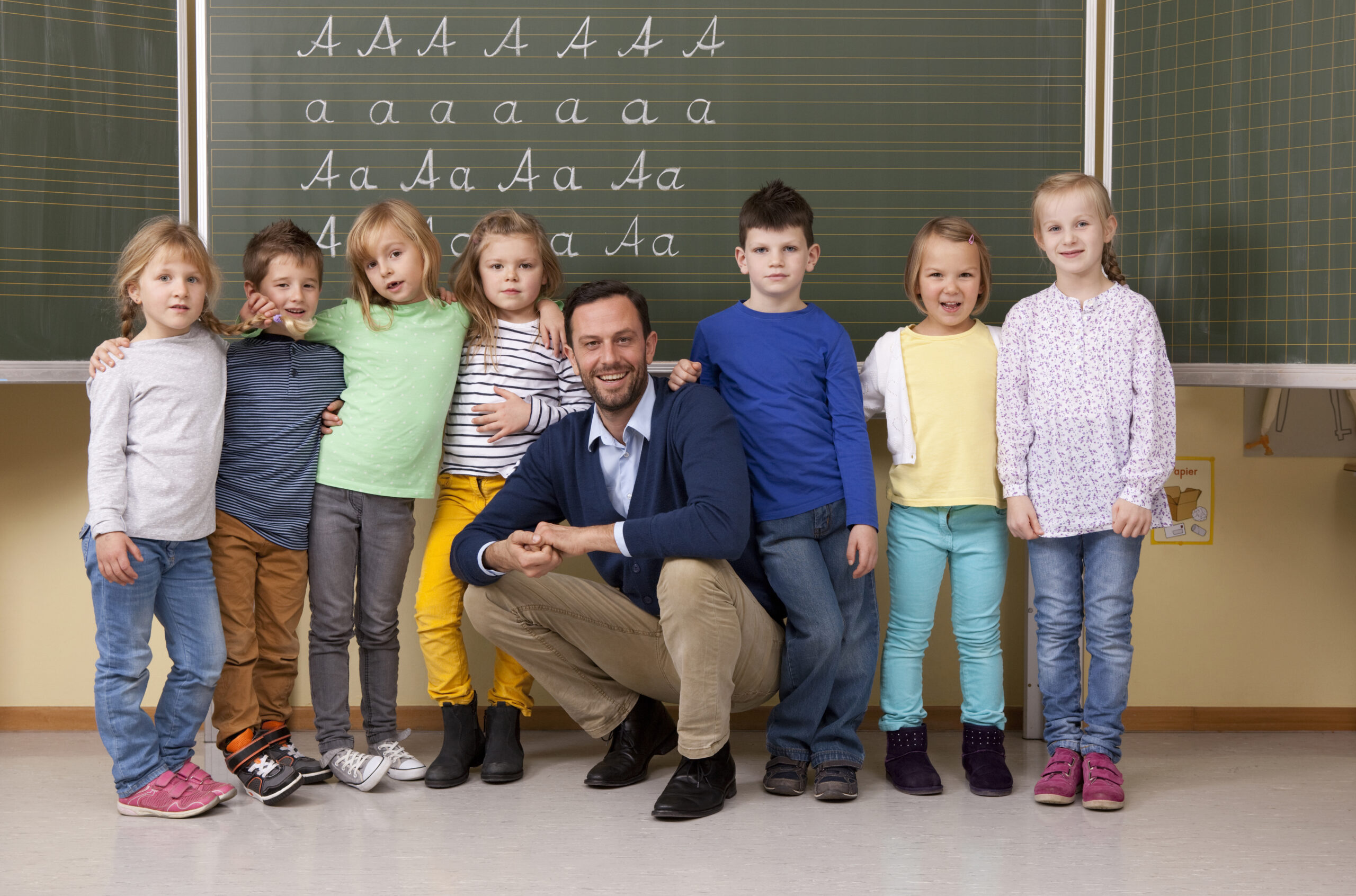 elementary school teacher and students posing toge 2026 01 05 00 45 17 utc scaled